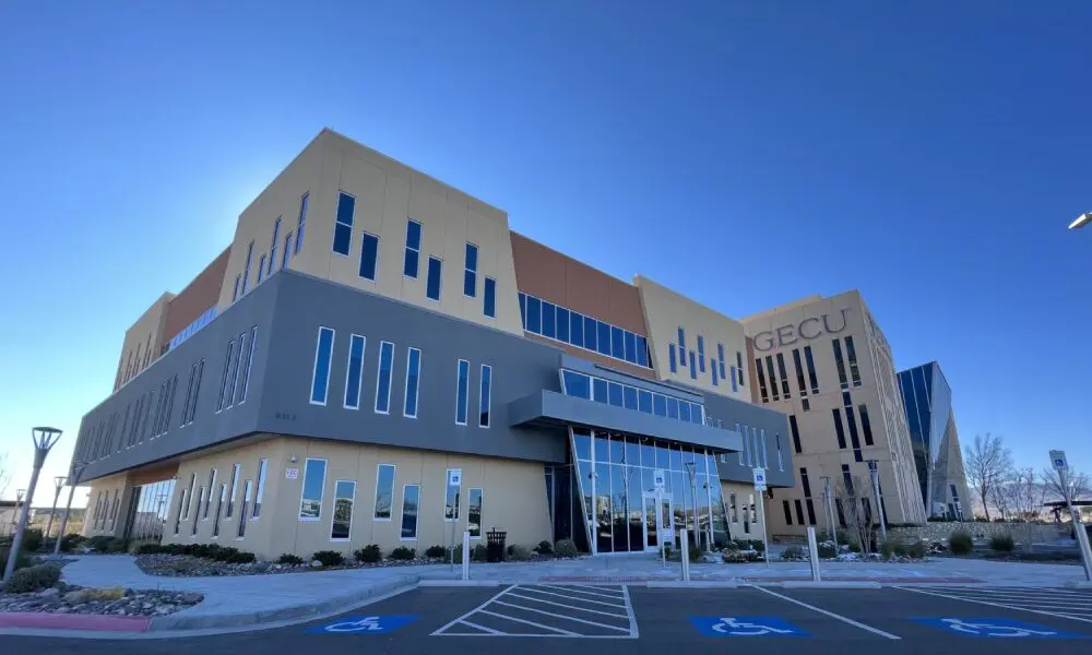 A large building with many windows and lots of glass.