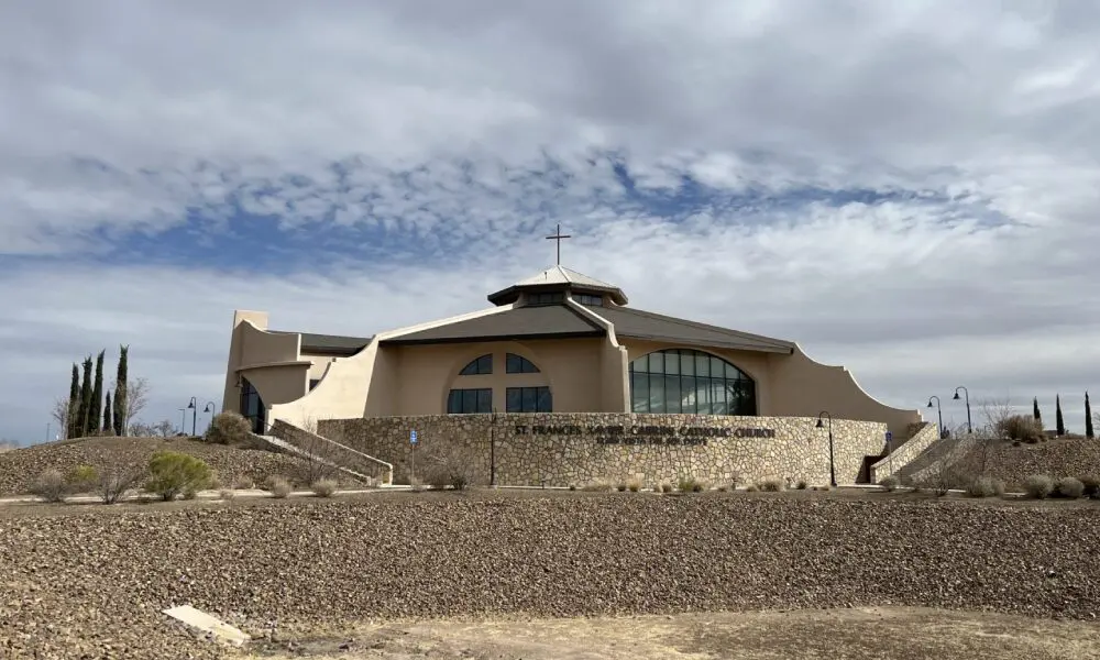 A large building with a sky background