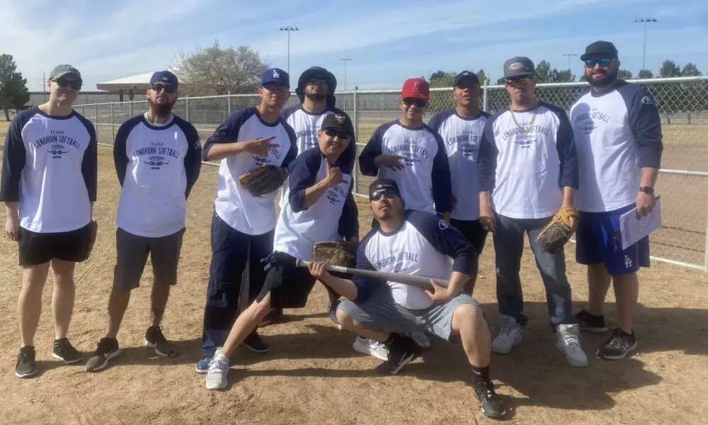 A group of men standing on top of a baseball field.