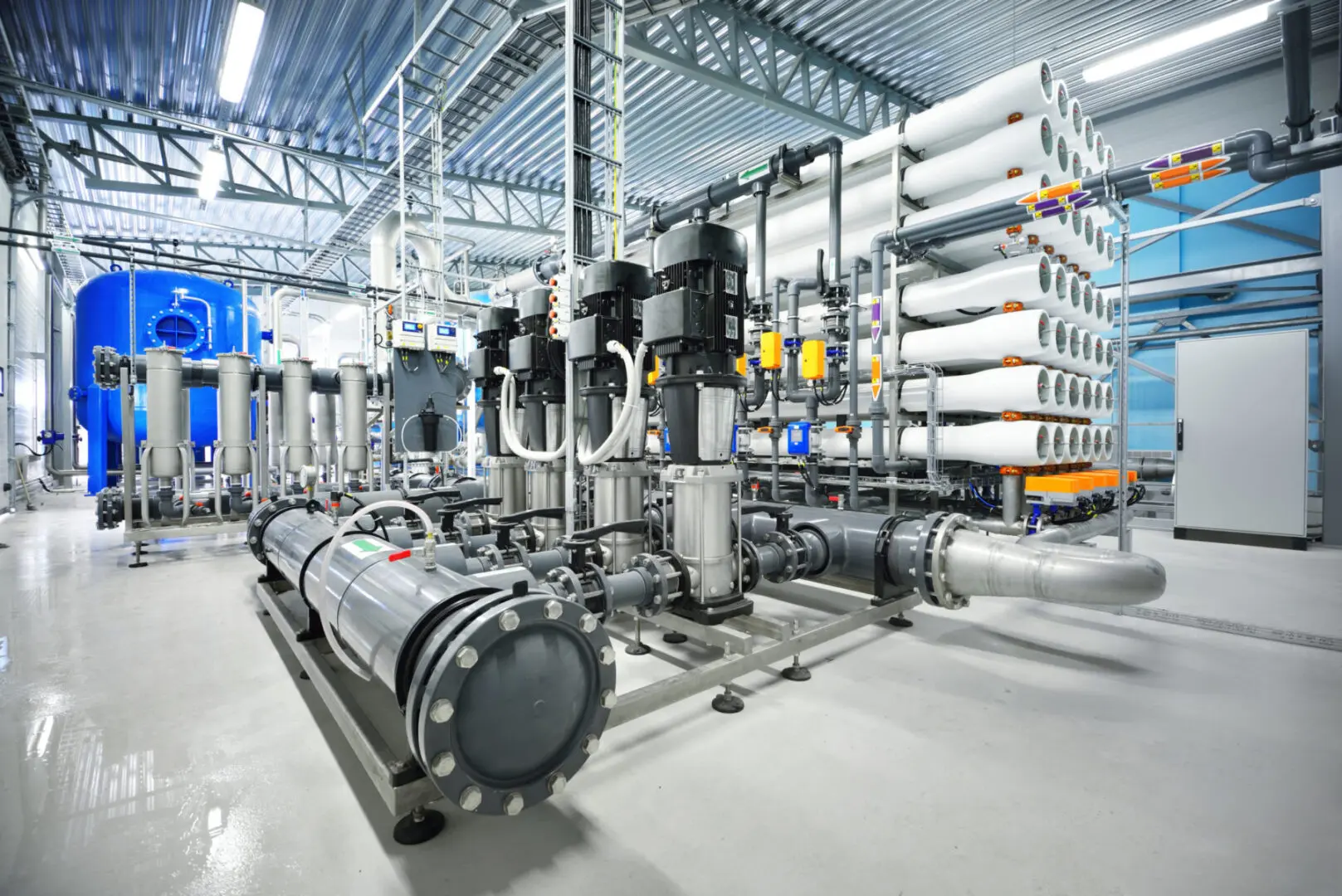 A large industrial water treatment plant with many pipes.